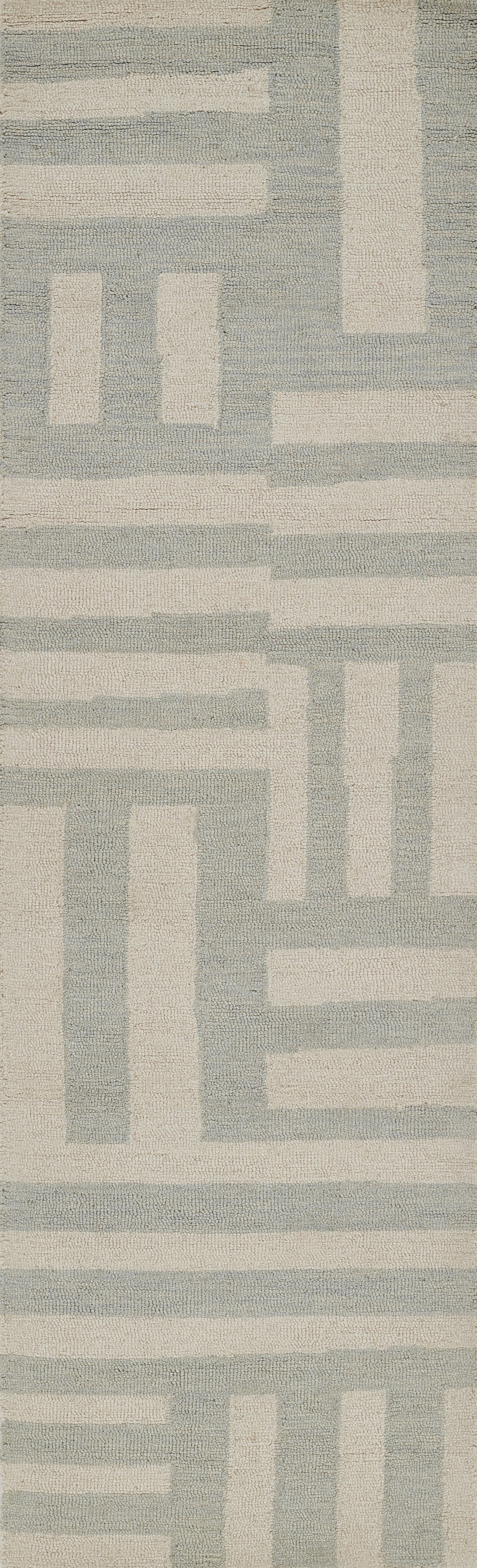 Modern geometric area rug in ivory and blue-gray with interlocking rectangular bands and a soft woven texture.