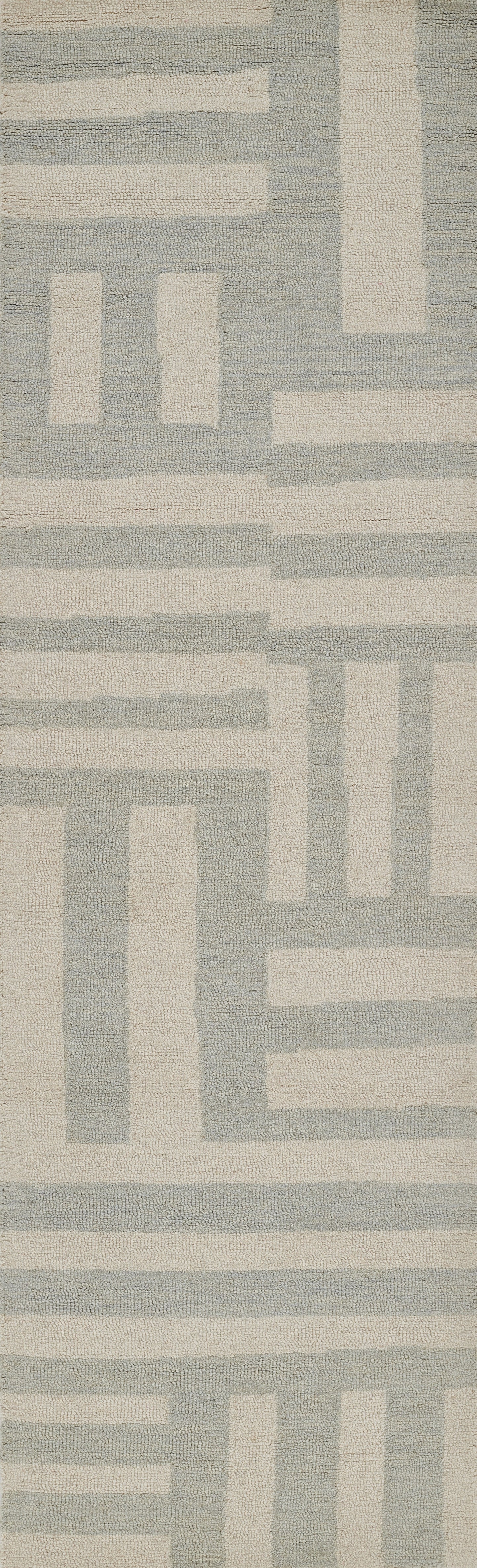 Textured blue-gray and beige area rug with a geometric maze pattern; modern woven style.