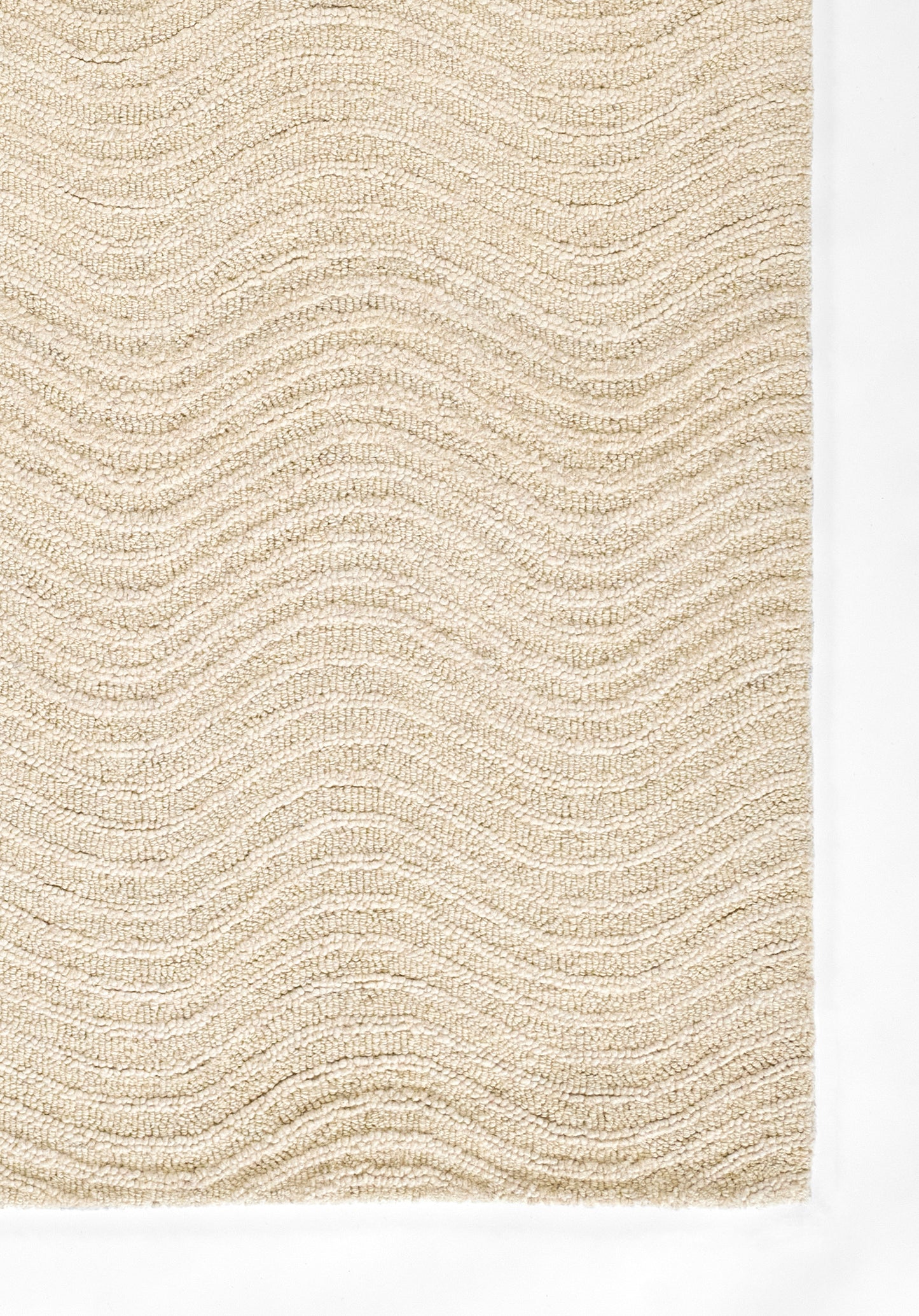 Beige textured rug with soft loop pile and gentle wavy stripe pattern.