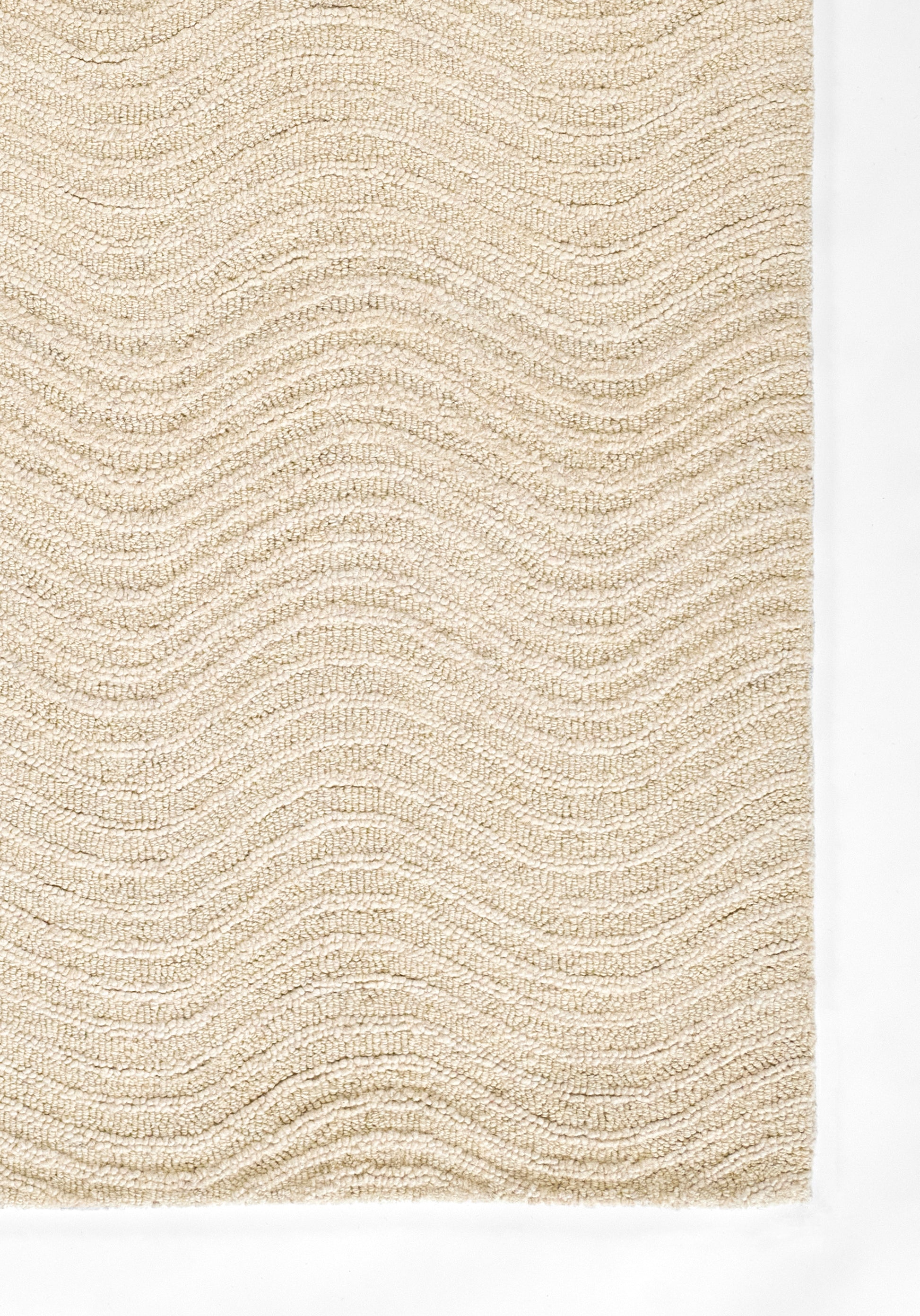Beige textured rug with soft loop pile and gentle wavy stripe pattern.