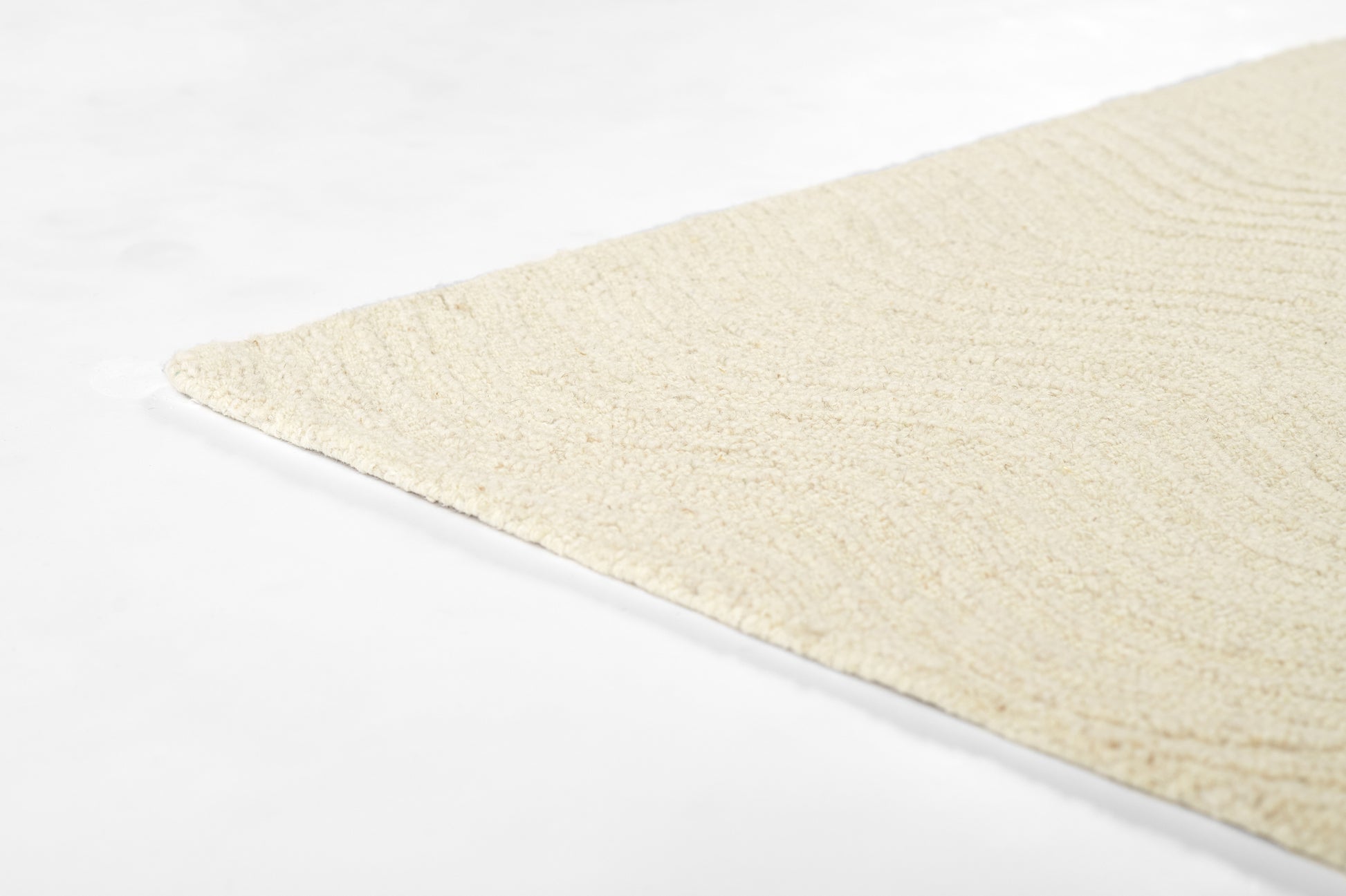 Cream ivory shag runner rug corner on white background; plush, textured pile with soft, modern look.