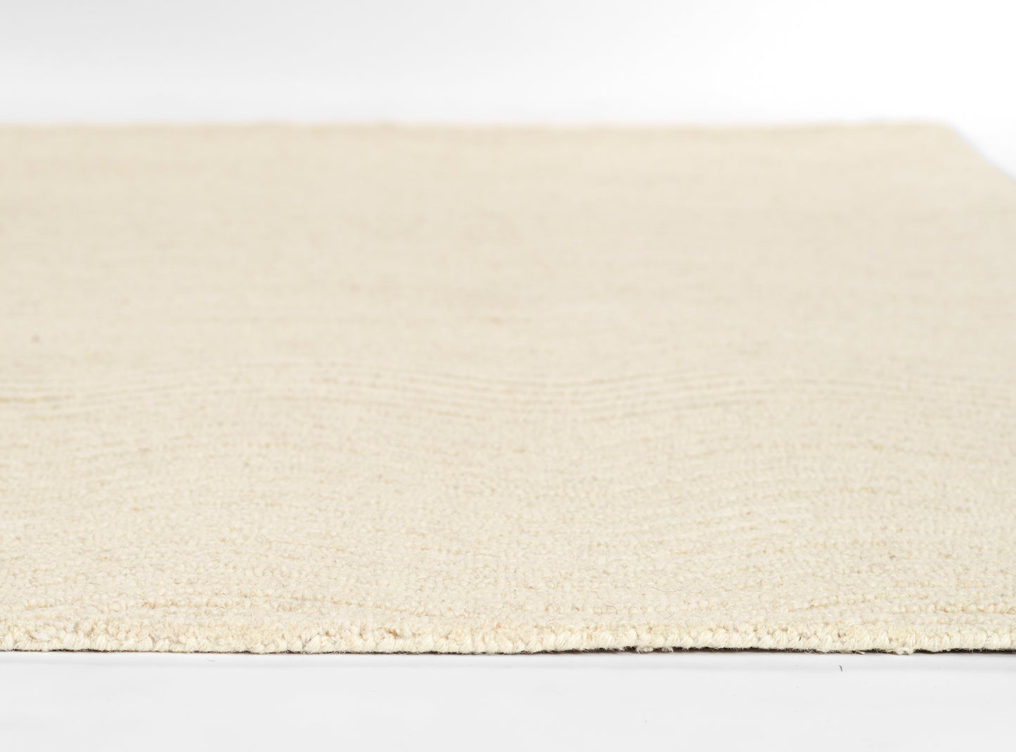 Ivory cream rectangular rug with soft plush pile; minimalist home decor, ideal for living room or bedroom.