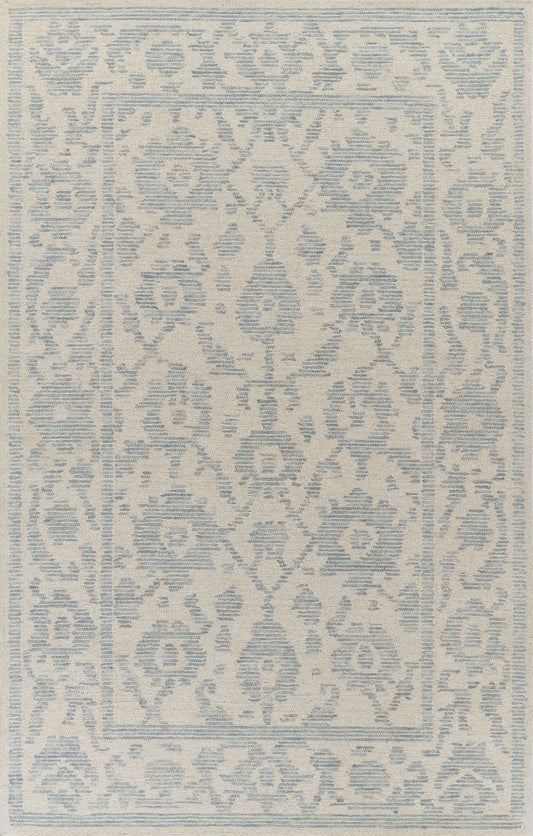 Cream rug with soft blue distressed geometric arabesque pattern and central medallion, bordered by a decorative frame.