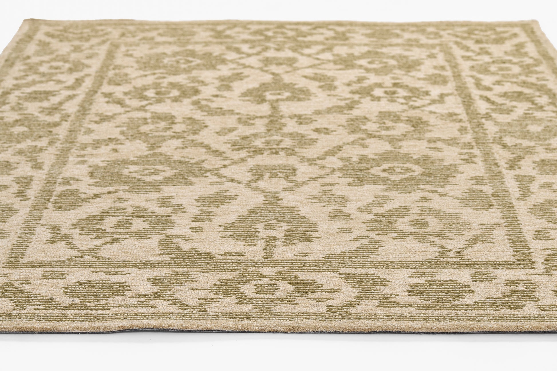Beige cream area rug with subtle sage-green damask pattern and decorative border; flatwoven, low-pile.