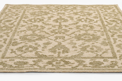 Beige cream area rug with subtle sage-green damask pattern and decorative border; flatwoven, low-pile.