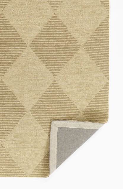Beige diamond-pattern woven rug with alternating solid and striped diamonds; soft texture, folded corner reveals gray backing.