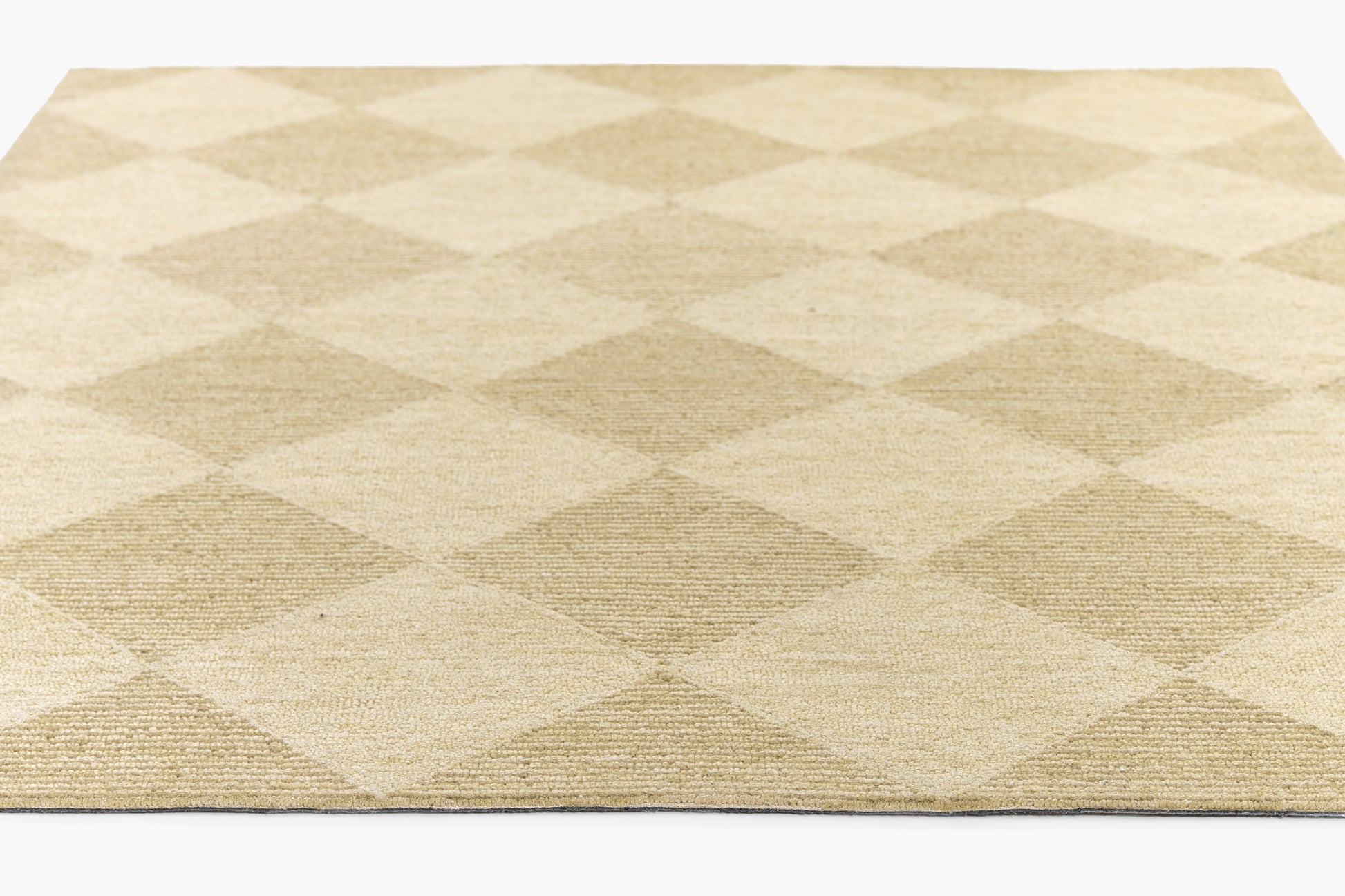Beige and taupe diamond-pattern flat-weave rug, rectangular; modern casual living room decor.