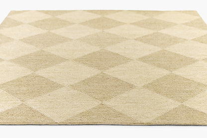 Beige woven rug with large cream & taupe diamond pattern; textured, rectangular floor decor.