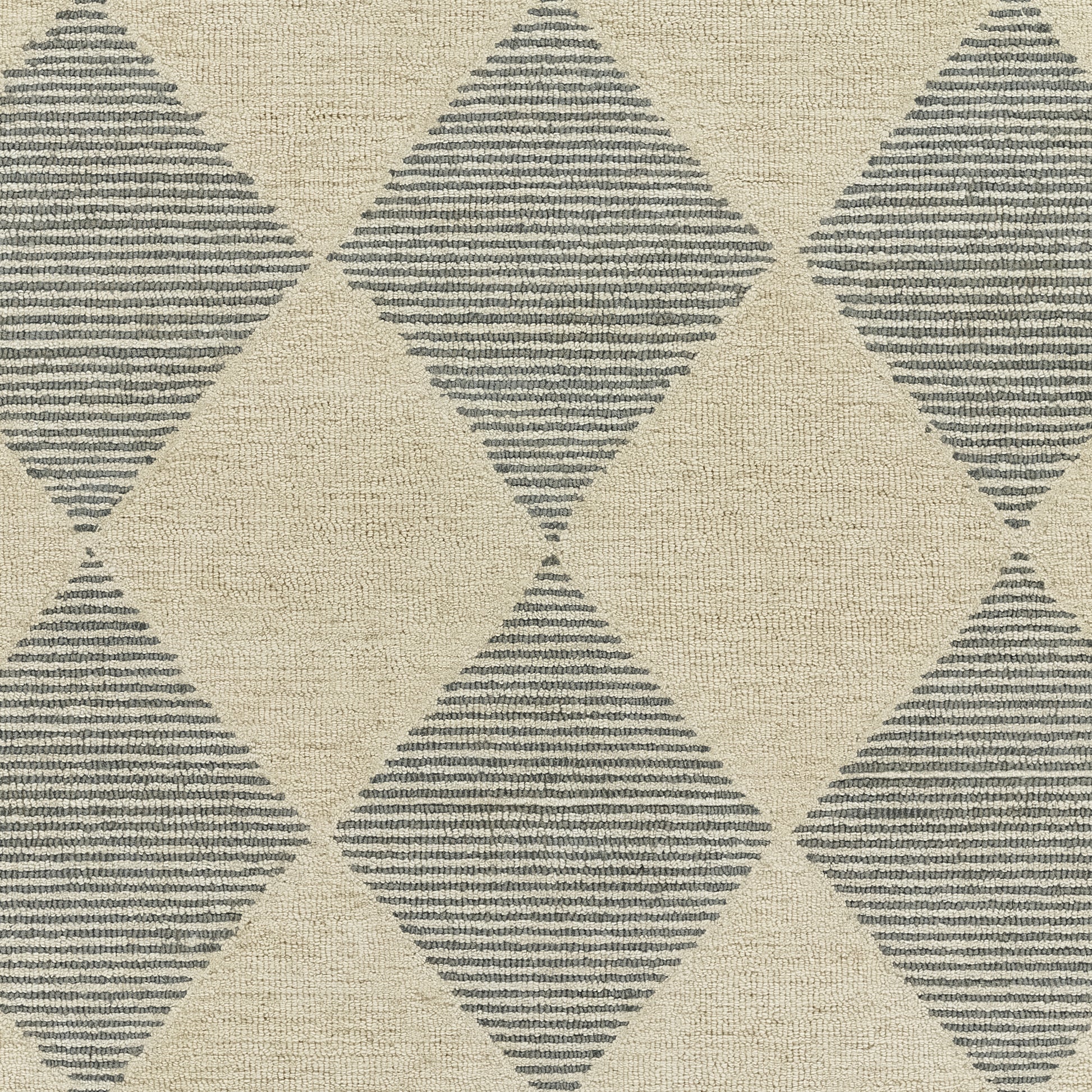 Beige textured area rug with large gray-blue diamond pattern formed by horizontal stripes.
