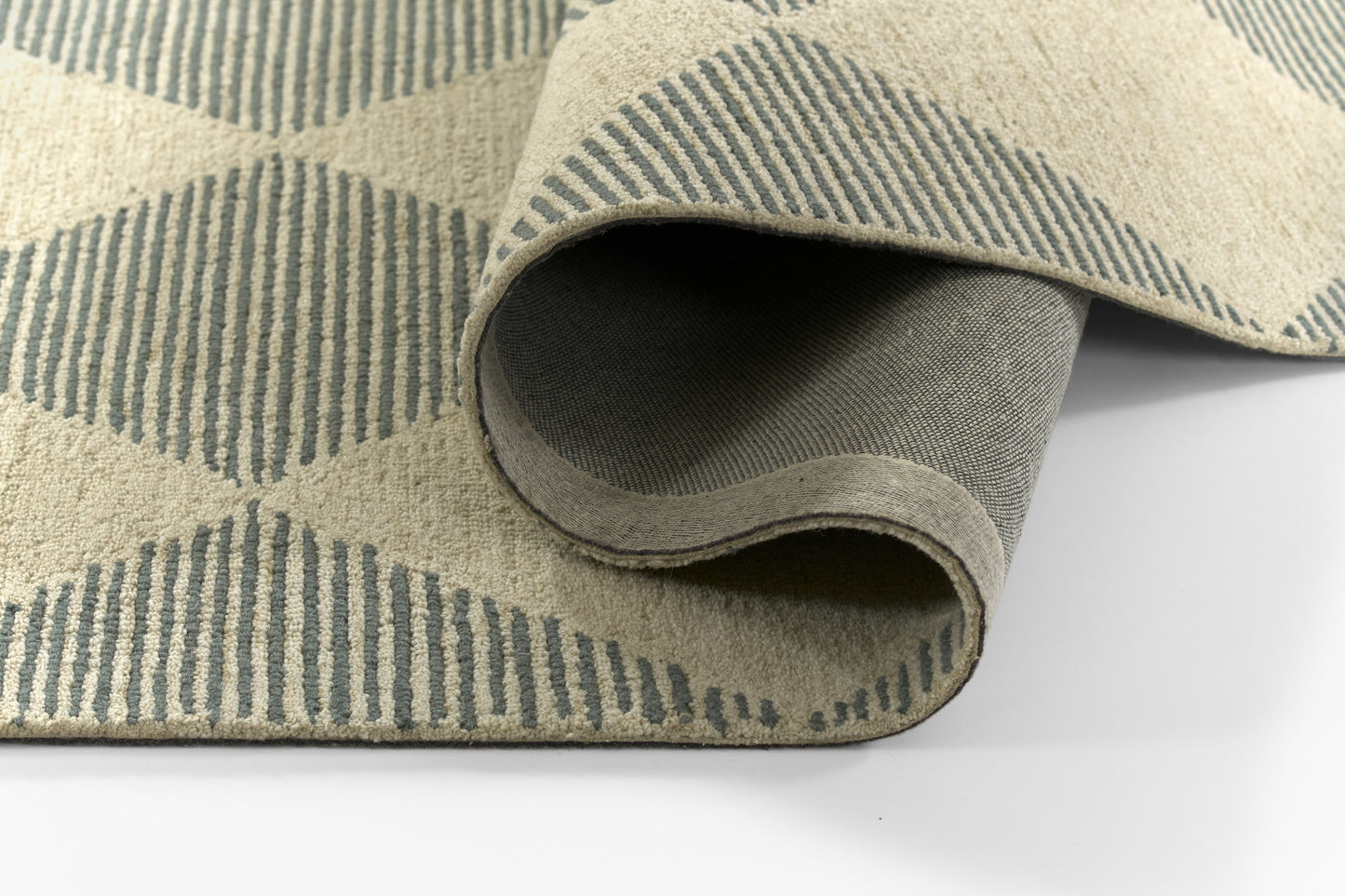 Beige and blue geometric area rug with diamond pattern, rolled edge and soft woven pile.