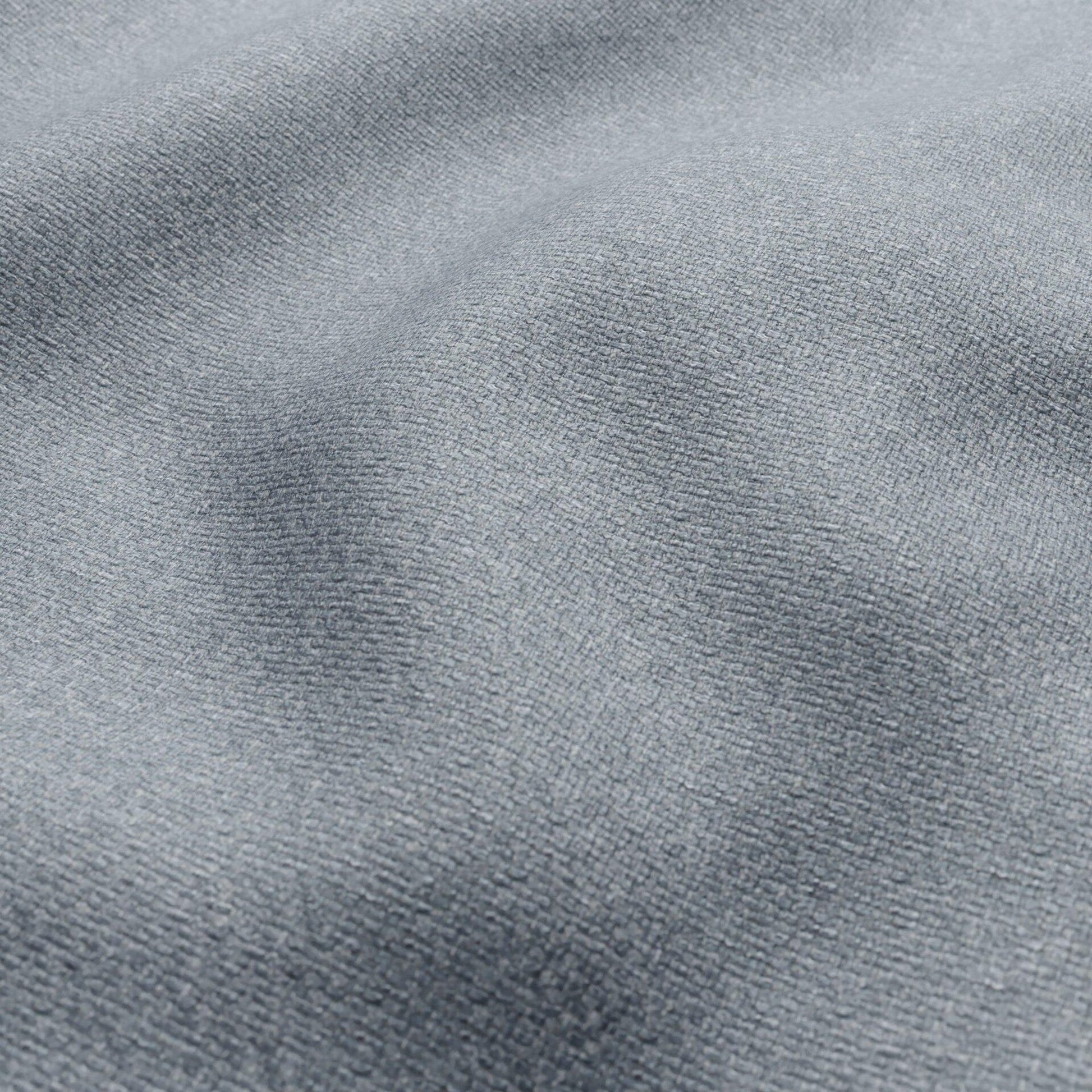 Blue basketweave fabric with a textured, woven surface.
