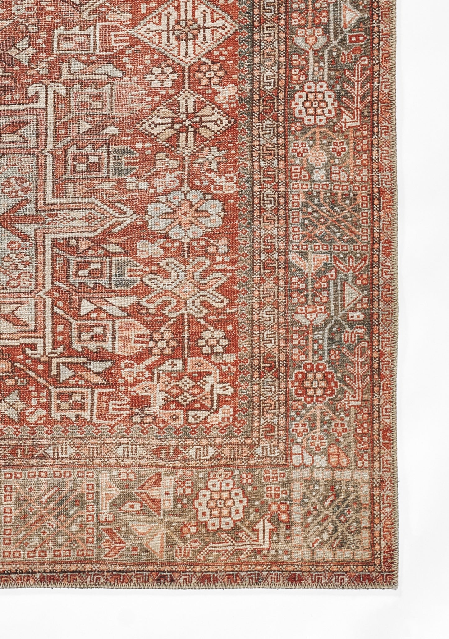 Rectangular oriental rug in red, ivory and brown with floral and geometric motifs; fringed edges.