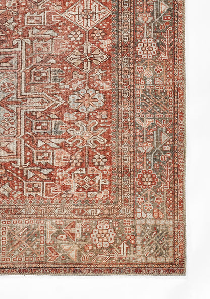 Rectangular oriental rug in red, ivory and brown with floral and geometric motifs; fringed edges.
