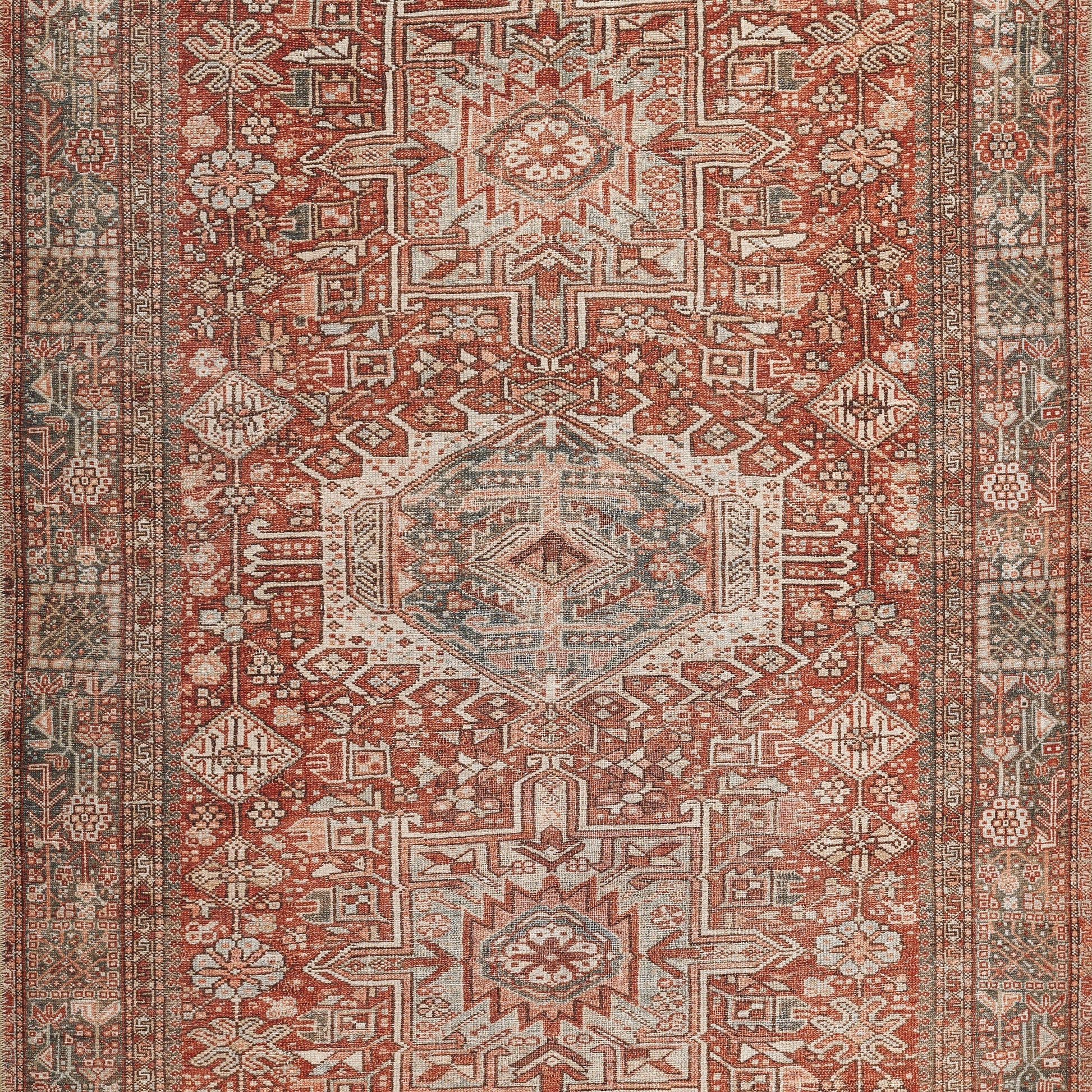 Rectangular Persian/Oriental rug with red field, ivory central medallions, blue-green accents, geometric motifs and floral border.
