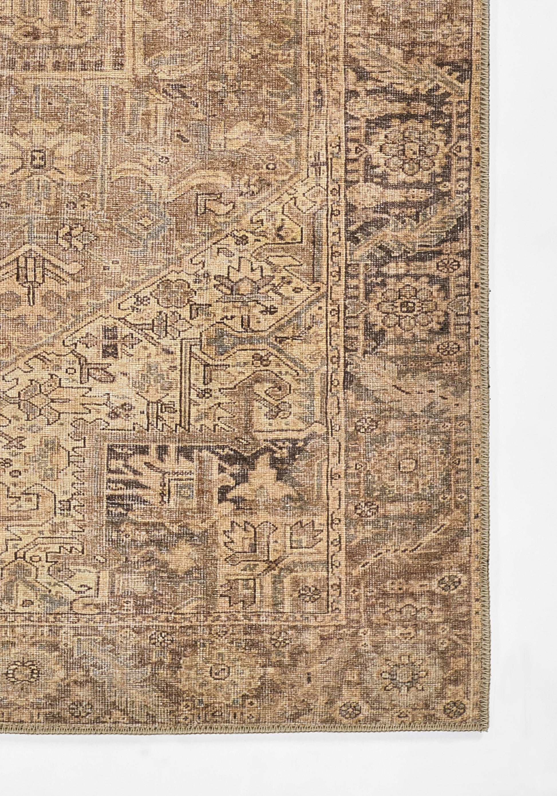 Brown antique-style oriental rug with tan accents, intricate floral motifs and decorative border.
