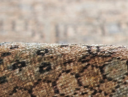 Close-up of a brown speckled stone surface with rough texture and curved edge.