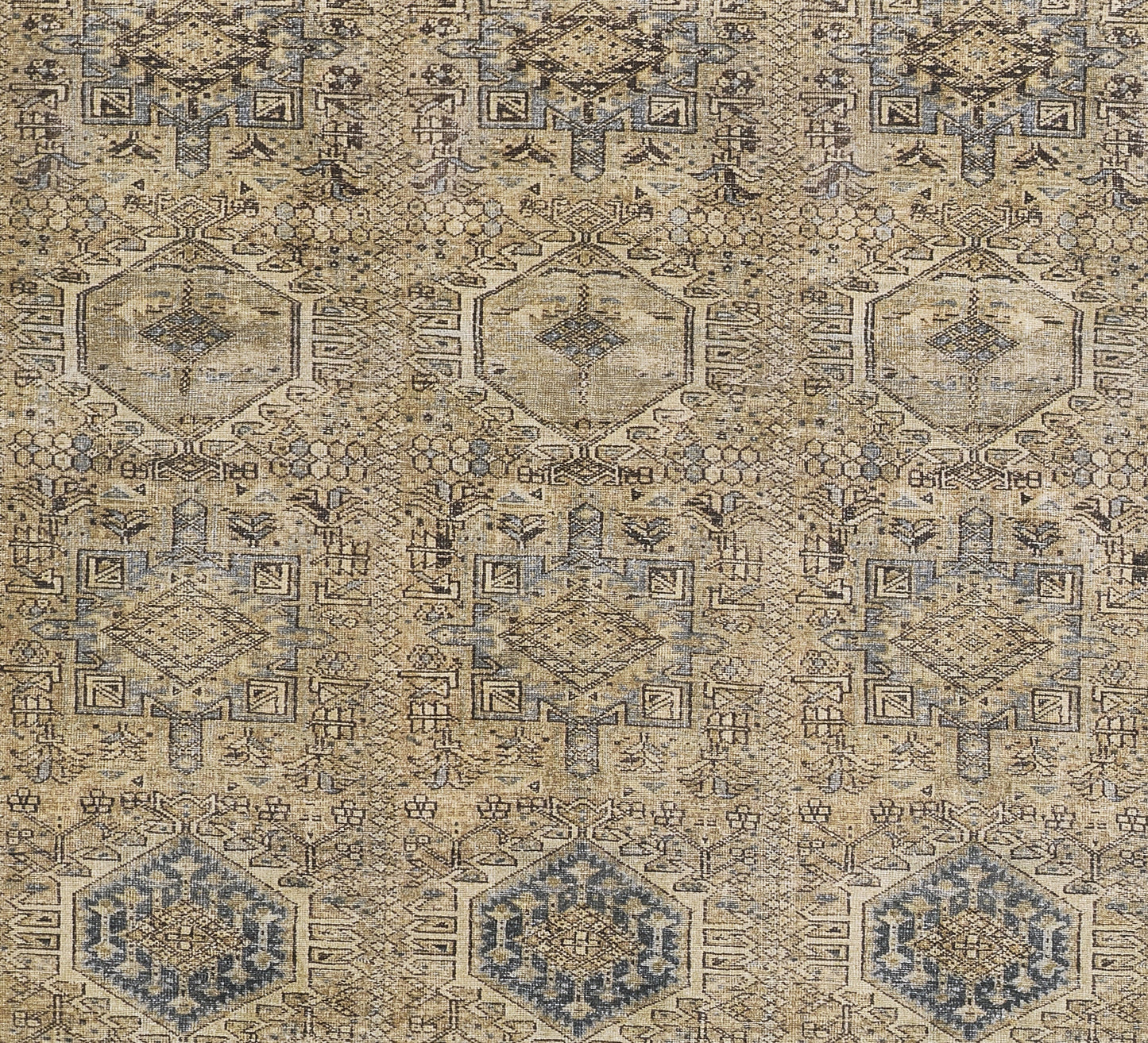 Beige-blue distressed geometric rug with hexagonal medallions and intricate motifs; vintage oriental style.