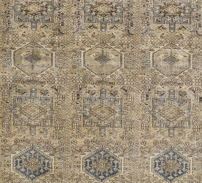 Beige-blue distressed geometric rug with hexagonal medallions and intricate motifs; vintage oriental style.