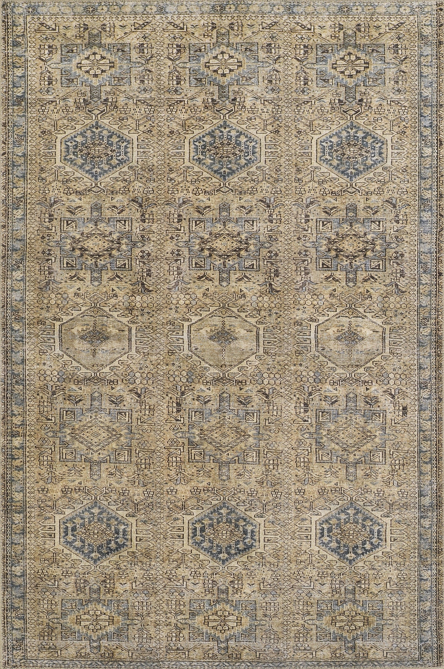 Muted beige oriental rug with blue geometric medallions, intricate patterns, and a bordered edge.