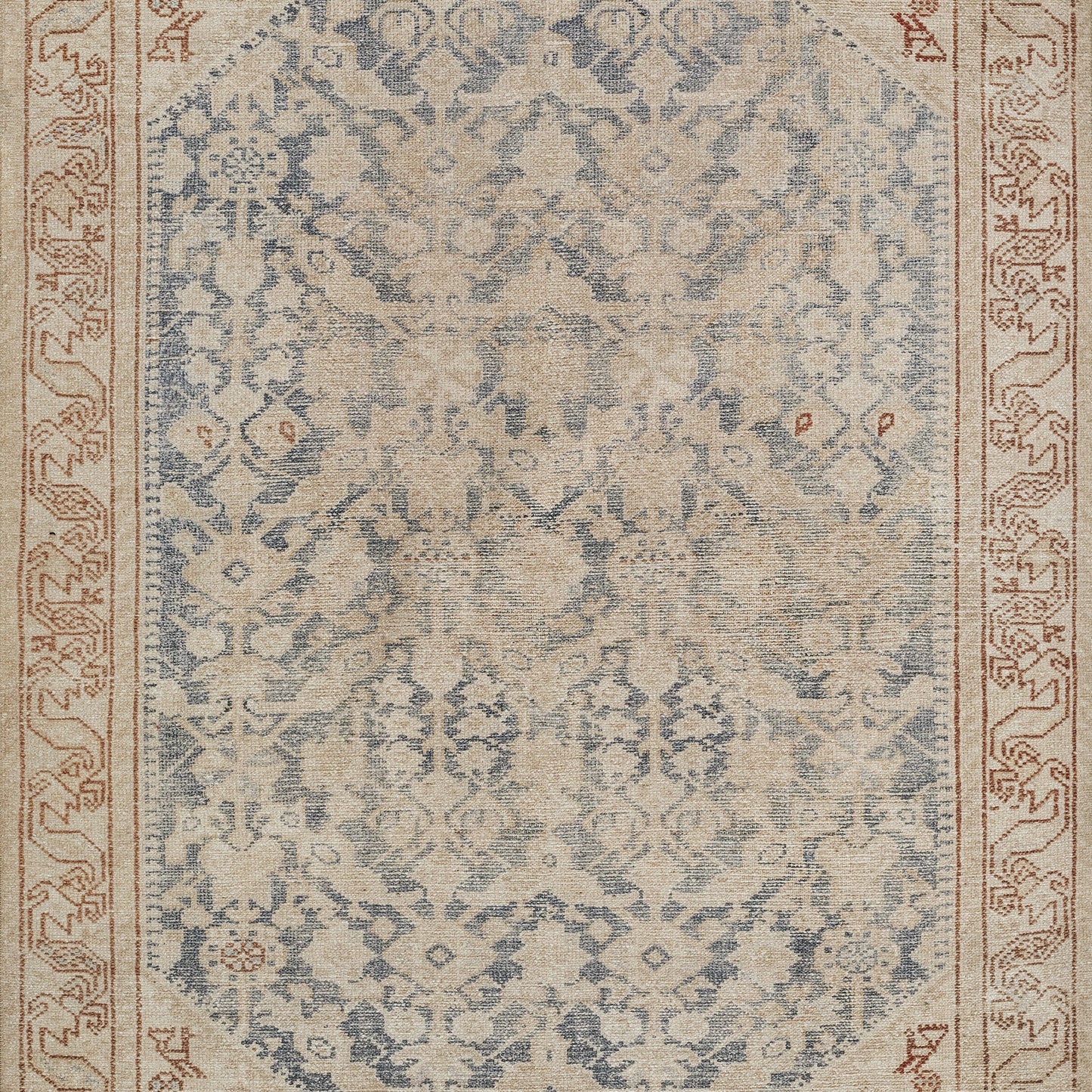 Rectangular blue-beige oriental rug with intricate floral damask pattern and red-brown border.