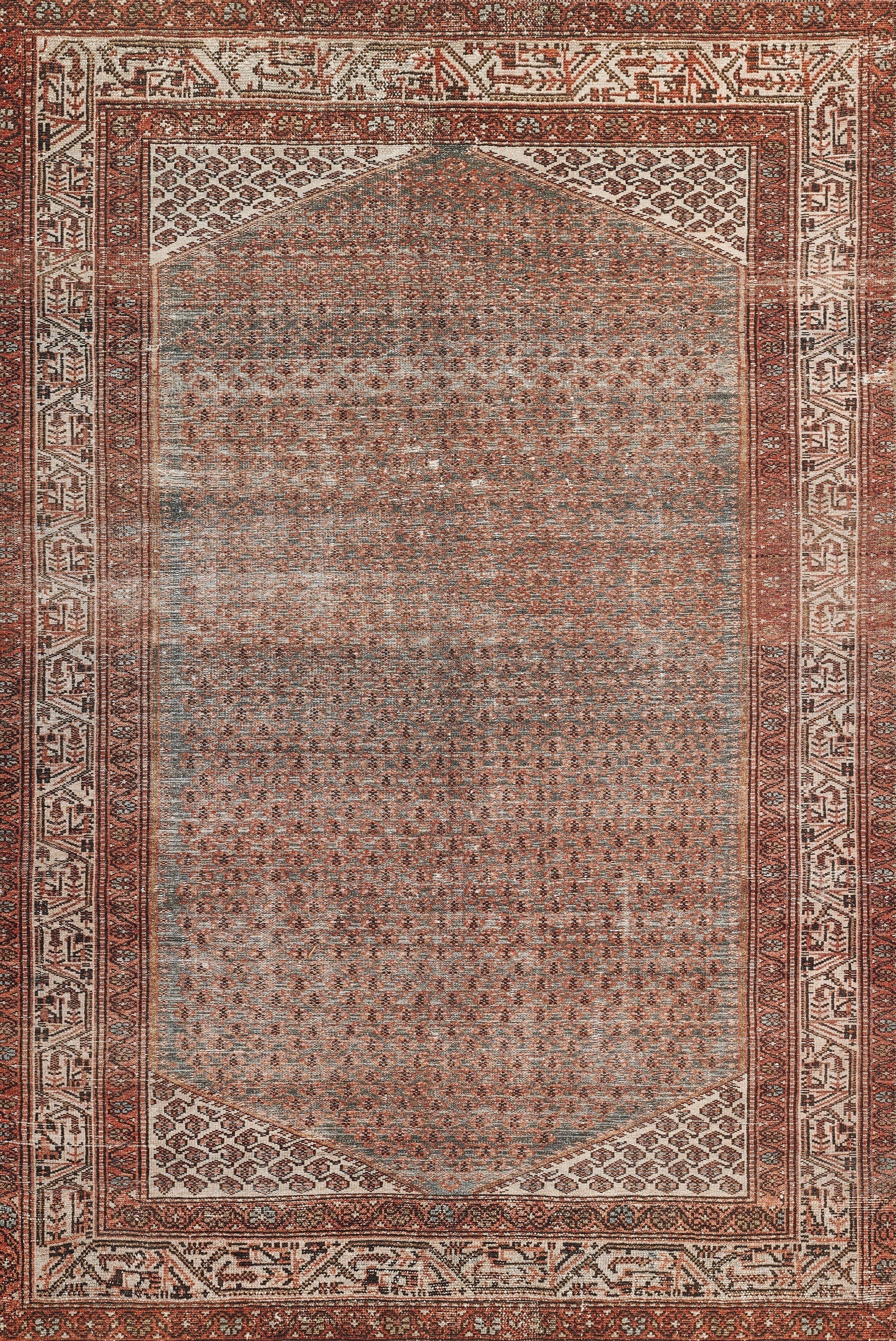 Distressed oriental rug with red border, ivory accents, blue-gray central field and geometric motifs; rectangular