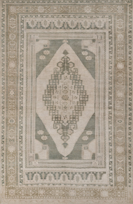 Muted sage, beige and ivory oriental rug with a large central diamond medallion and ornamental border.