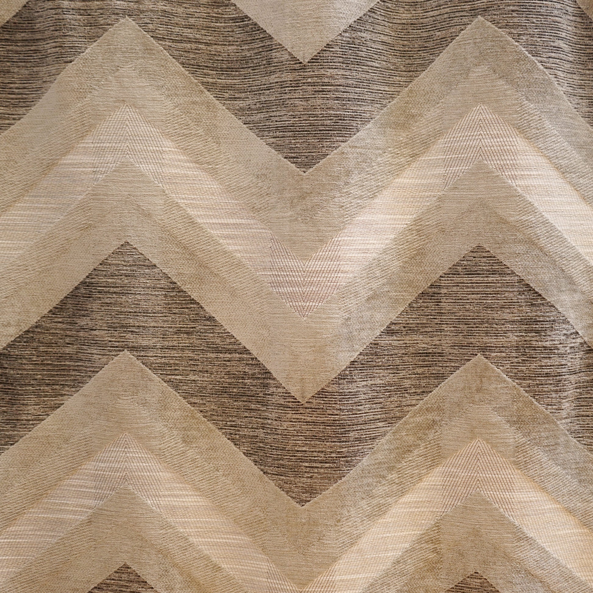 Chevron-pattern fabric in grey and silver chenille with a textured weave.