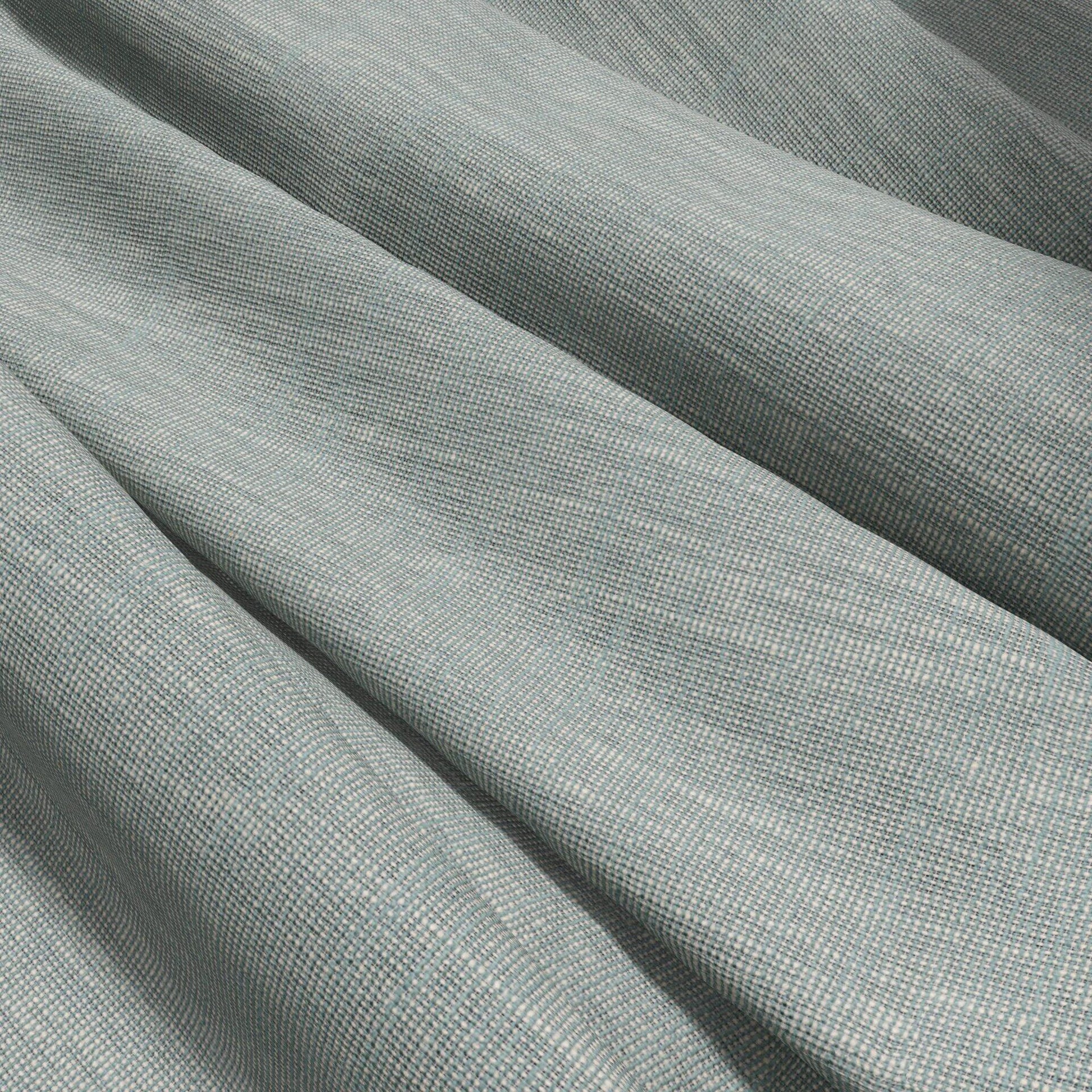 Green fabric with a textured weave, woven & sheer, draped in soft folds.