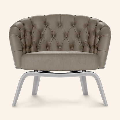 Taupe fabric accent chair with a buttoned back and curved arms on gray metal curved legs.