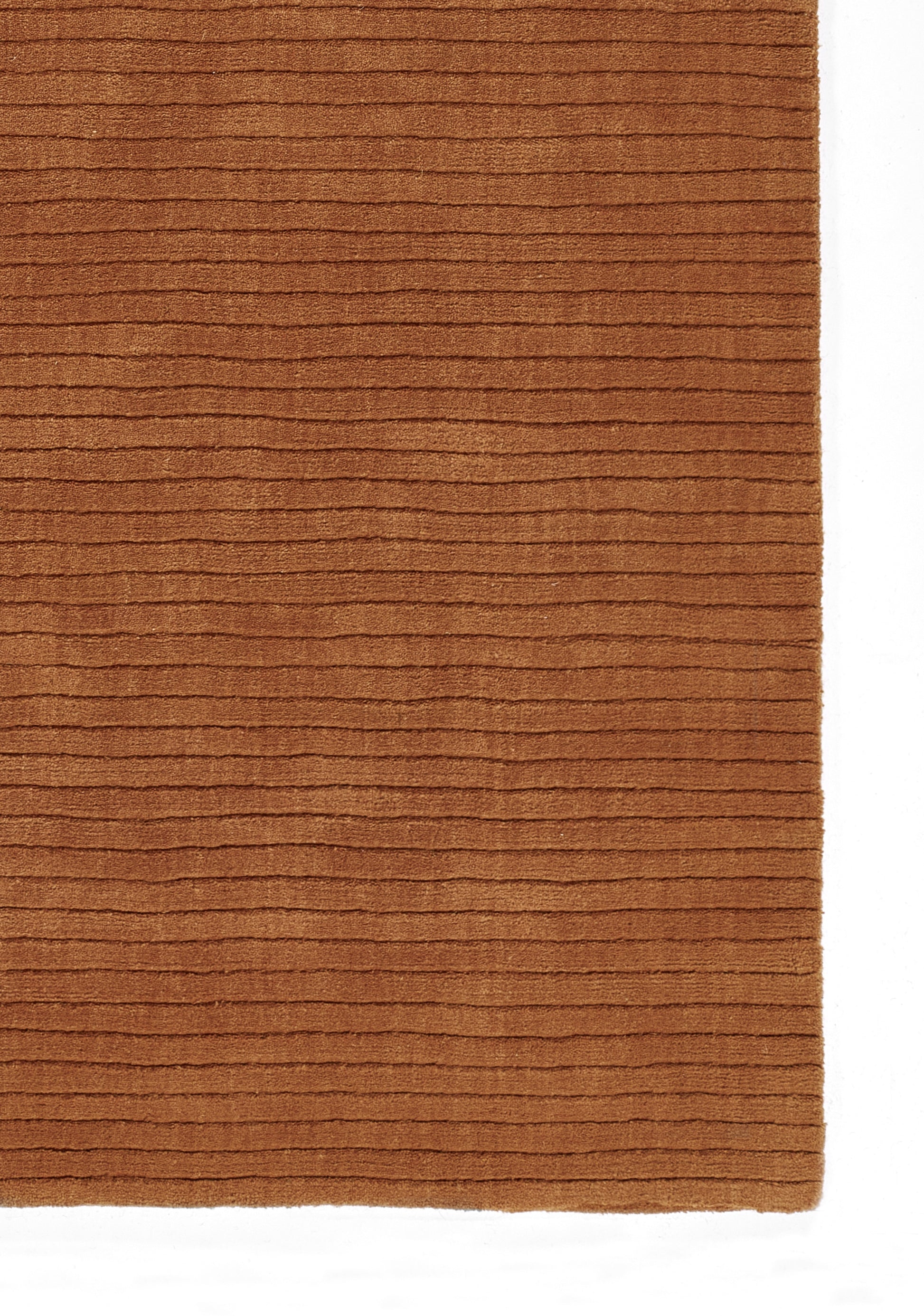 Rust-brown ribbed rug with horizontal lines and soft texture.