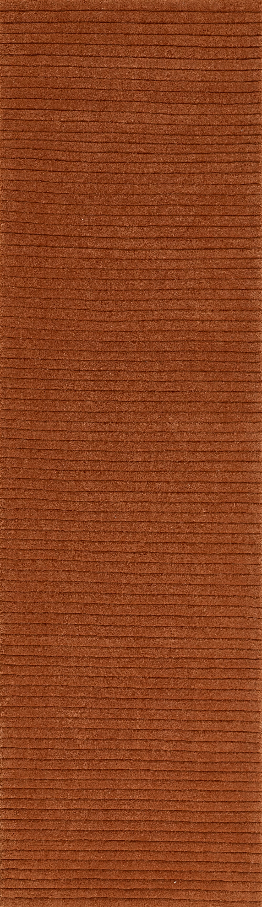 Rust-red corduroy-style rug with narrow, evenly spaced horizontal ridges.