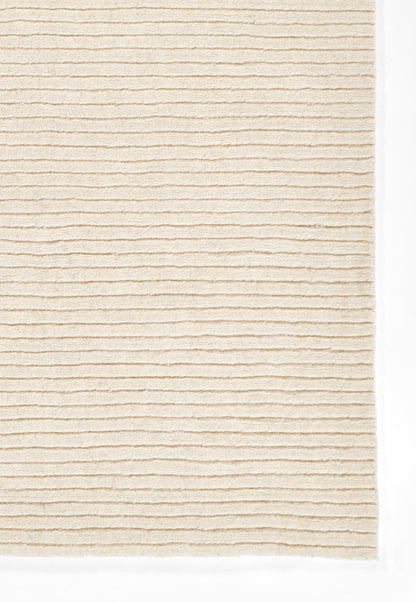 Beige ribbed rug with horizontal corduroy-like stripes and soft texture.