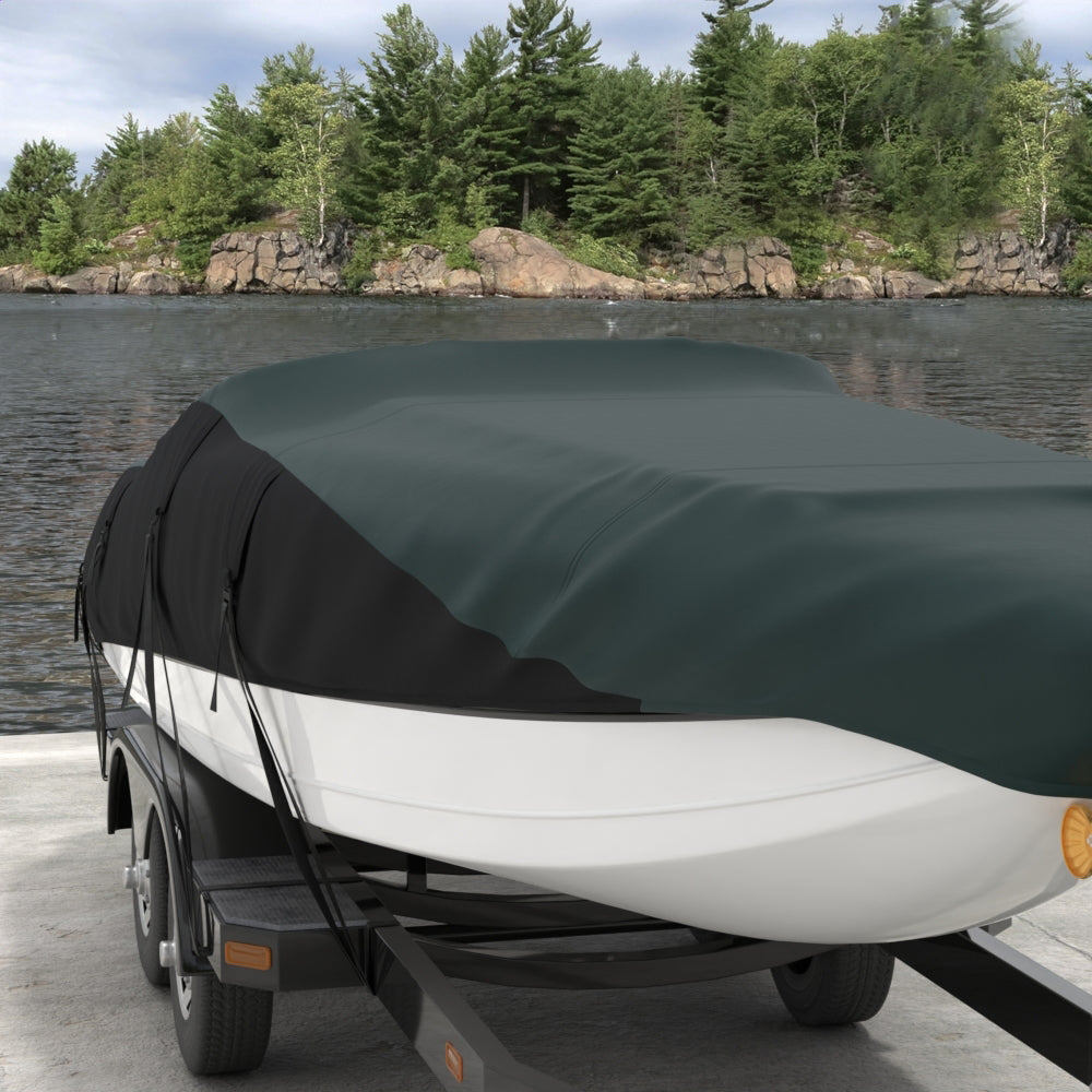 Green solid fabric material shown outdoors by a lake with a forested rocky shoreline.