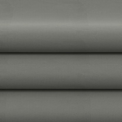 Gray solid fabric folded in horizontal layers, upholstery or drapery fabric.