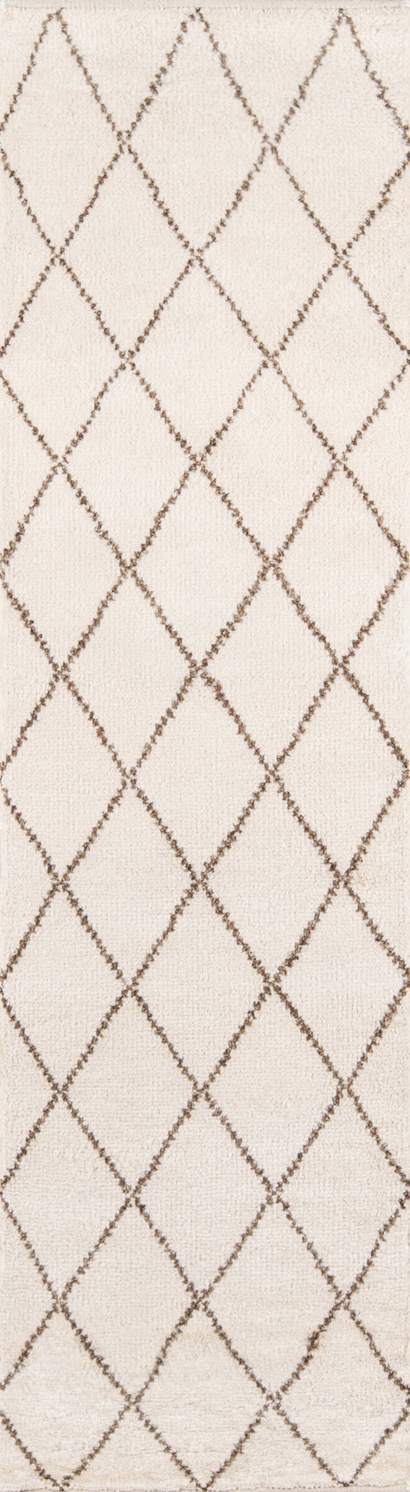 Cream rug with brown diamond lattice pattern and subtle woven texture.
