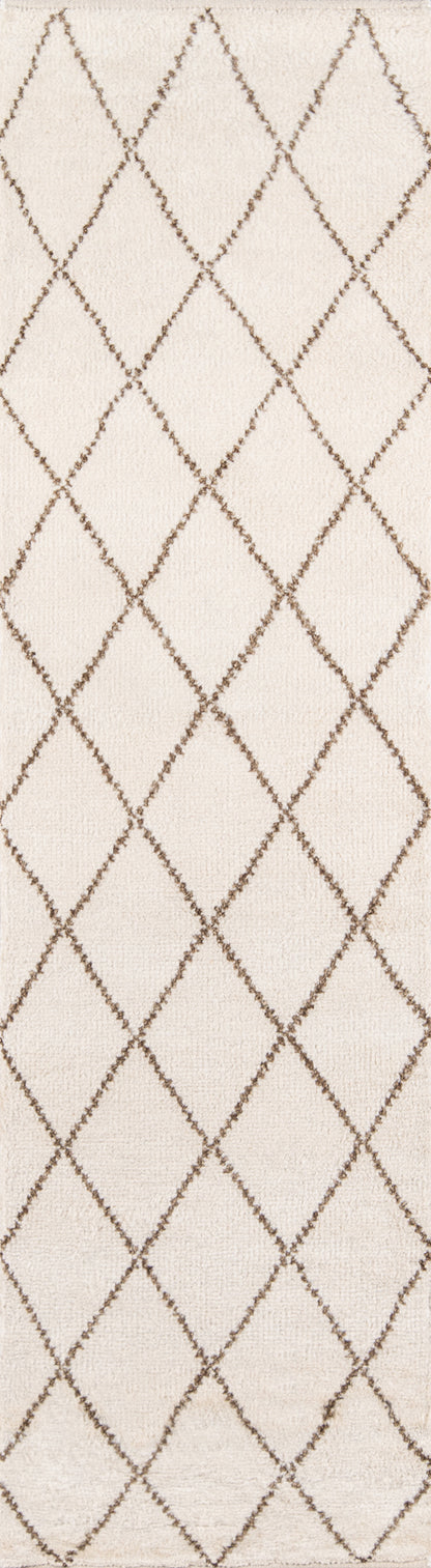 Cream rug with brown diamond lattice pattern and subtle woven texture.