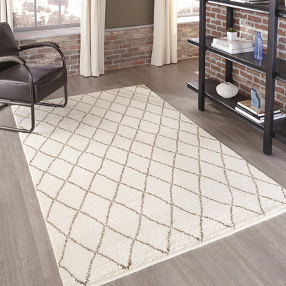 Beige rectangular runner rug with brown diamond lattice pattern, in a modern living room with brick walls.