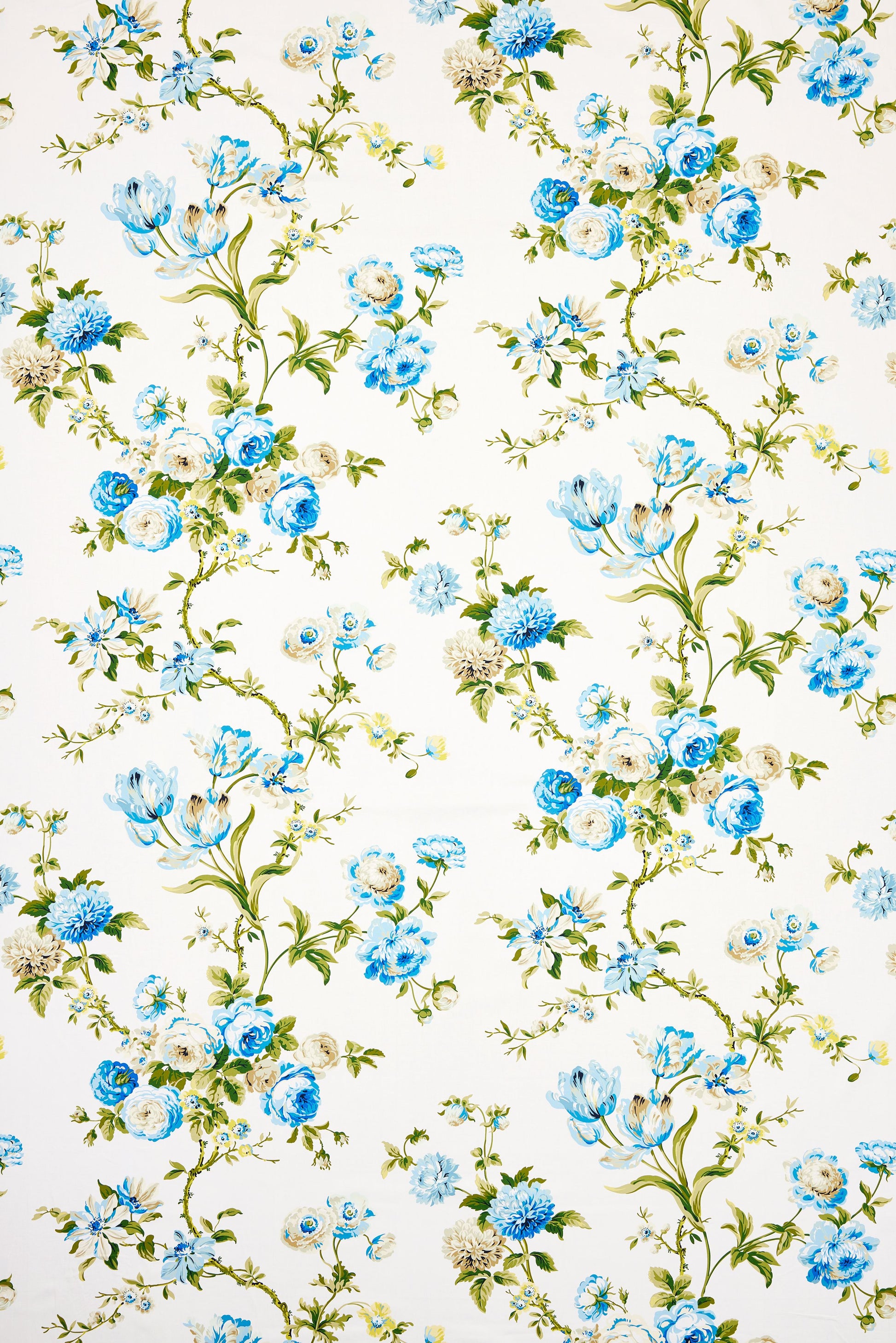 White fabric with blue flowers and green vines in a delicate botanical pattern