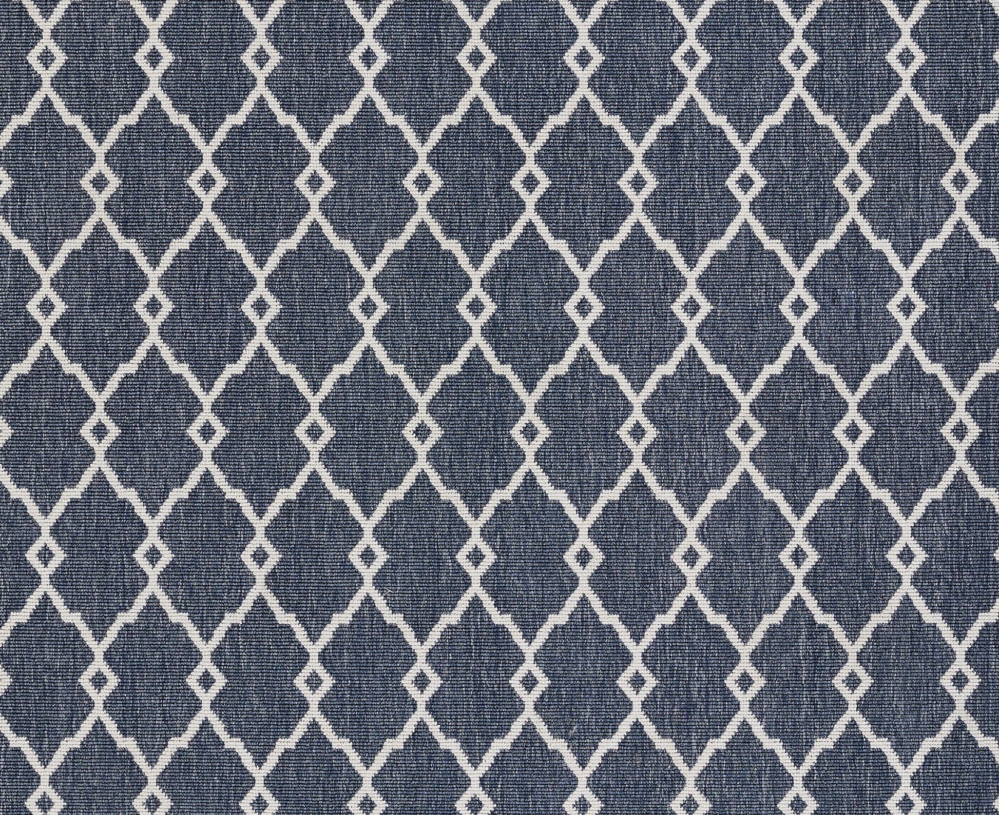 Navy blue rug with a white diamond lattice pattern; woven textile suitable for floors.