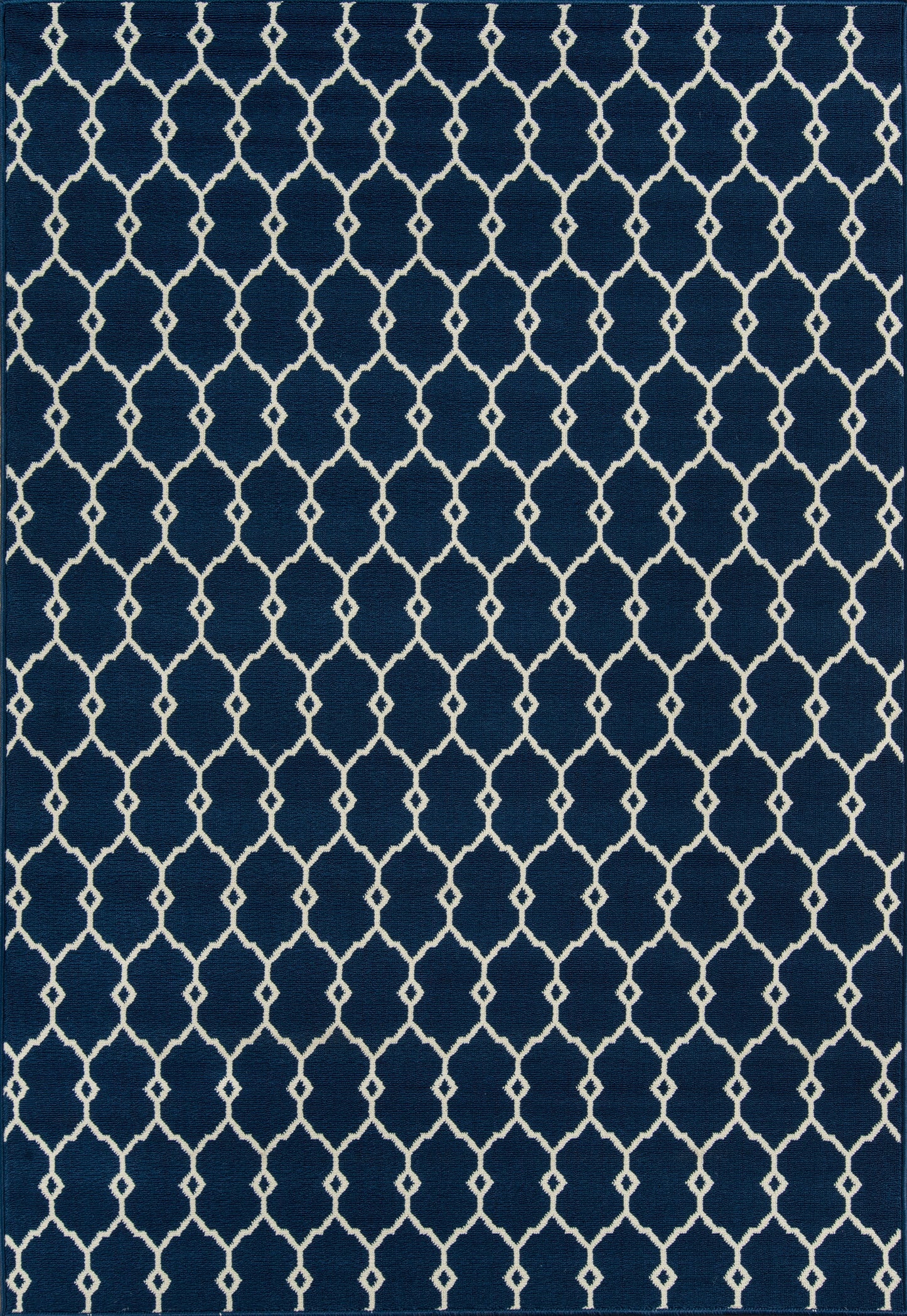Navy blue rug with white lattice/trellis pattern; modern geometric design for living room.