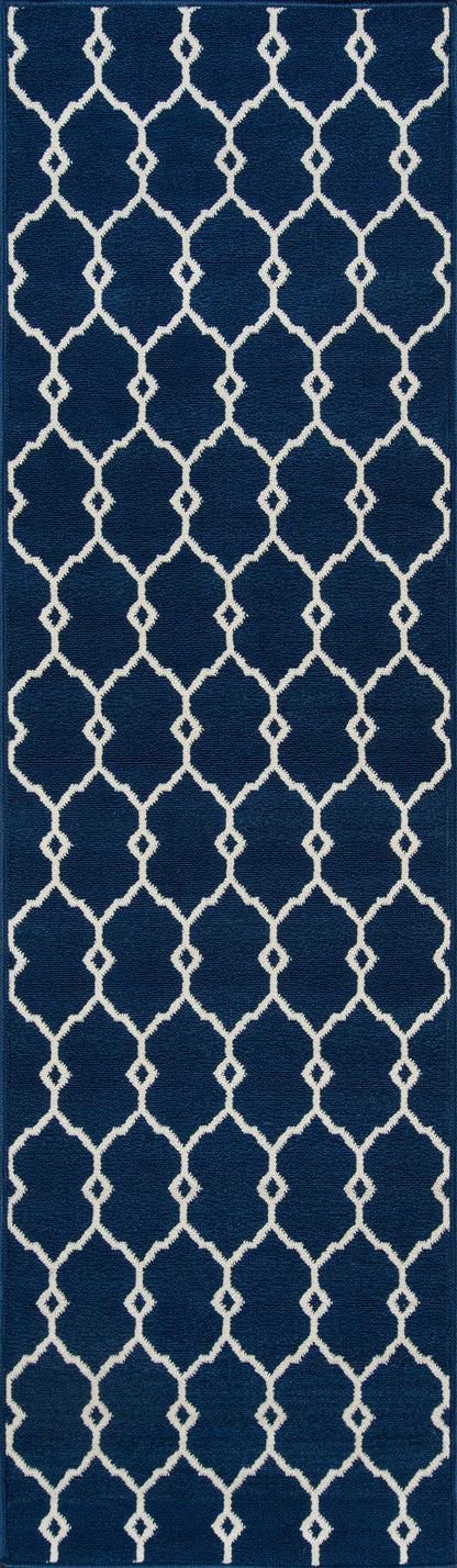 Navy blue background with cream geometric lattice and quatrefoil pattern; Moroccan-inspired trellis design.