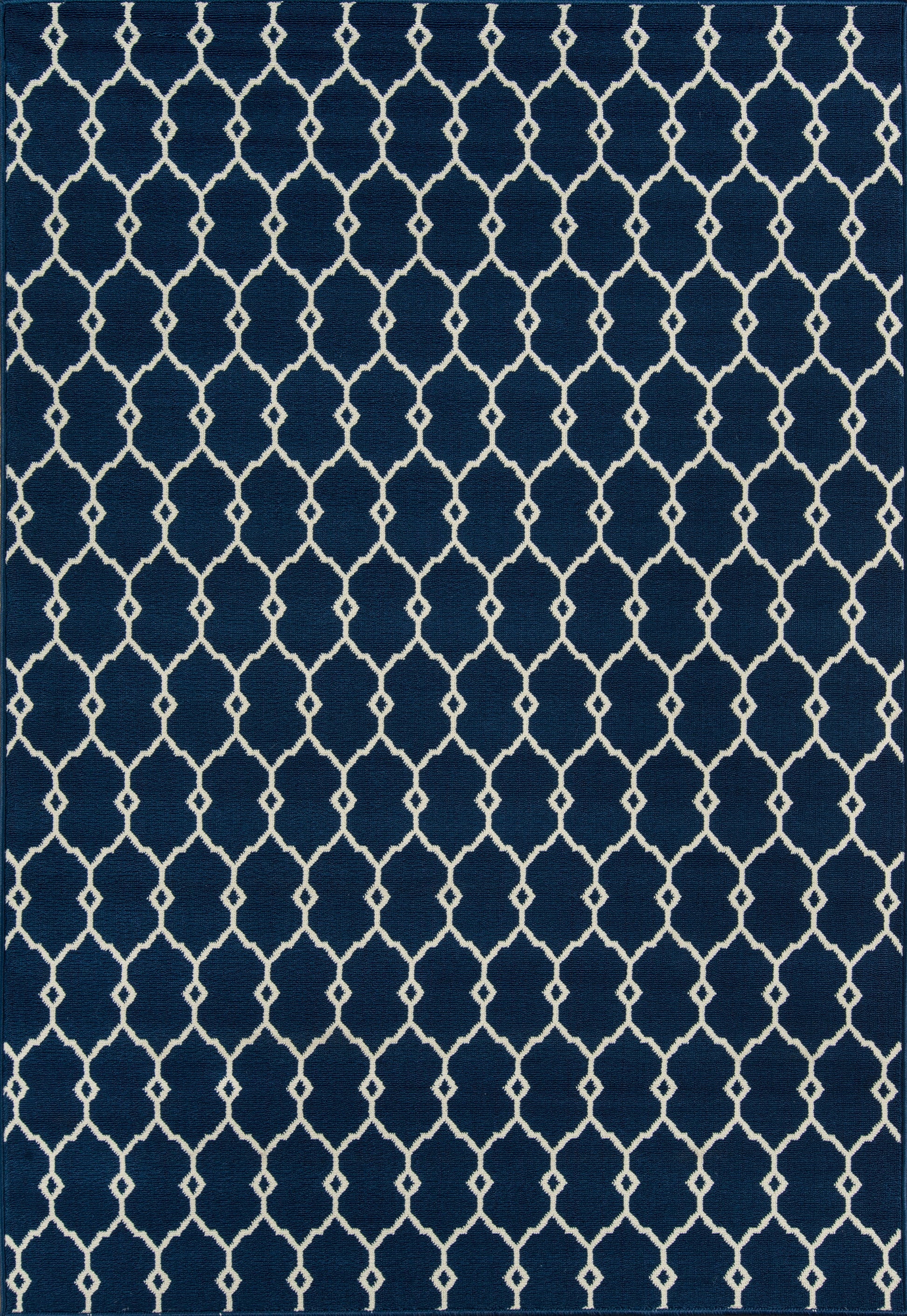 Navy blue woven rug with a white trellis lattice pattern of diamond shapes for a modern geometric look.