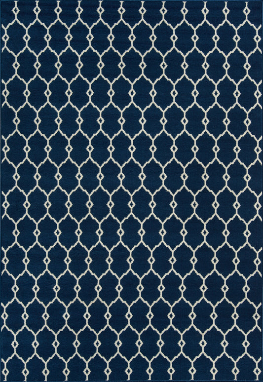 Navy blue area rug with white geometric trellis lattice pattern; rectangular, modern coastal decor.