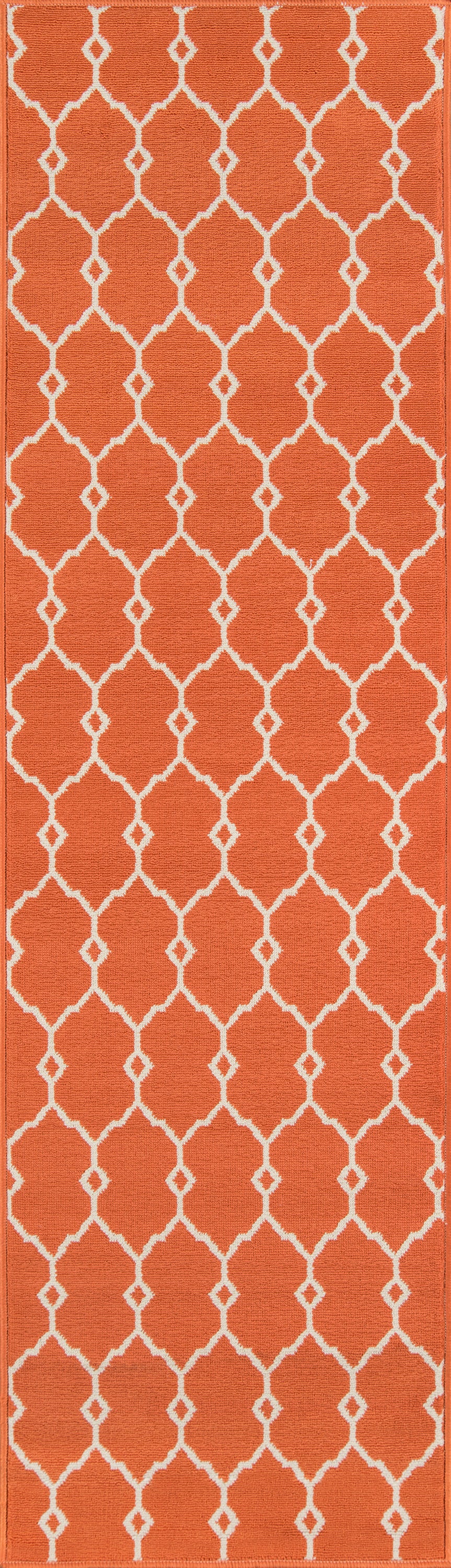 Orange rug with a white lattice trellis featuring repeating quatrefoil shapes.