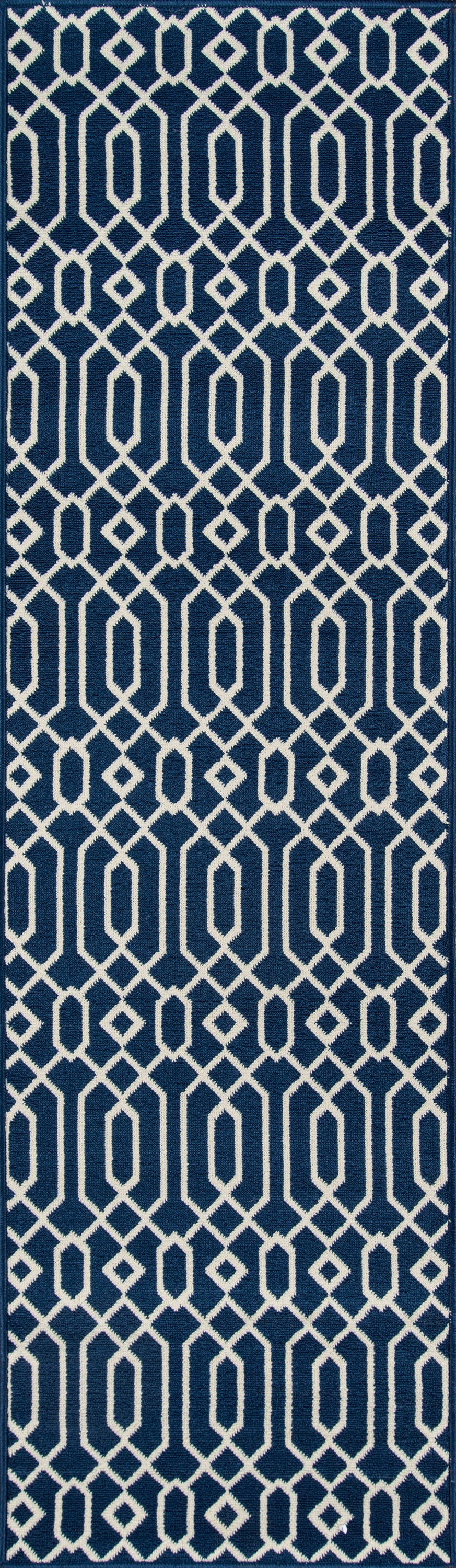Navy fabric with white interlocking chain-link geometric lattice; modern decorative textile.