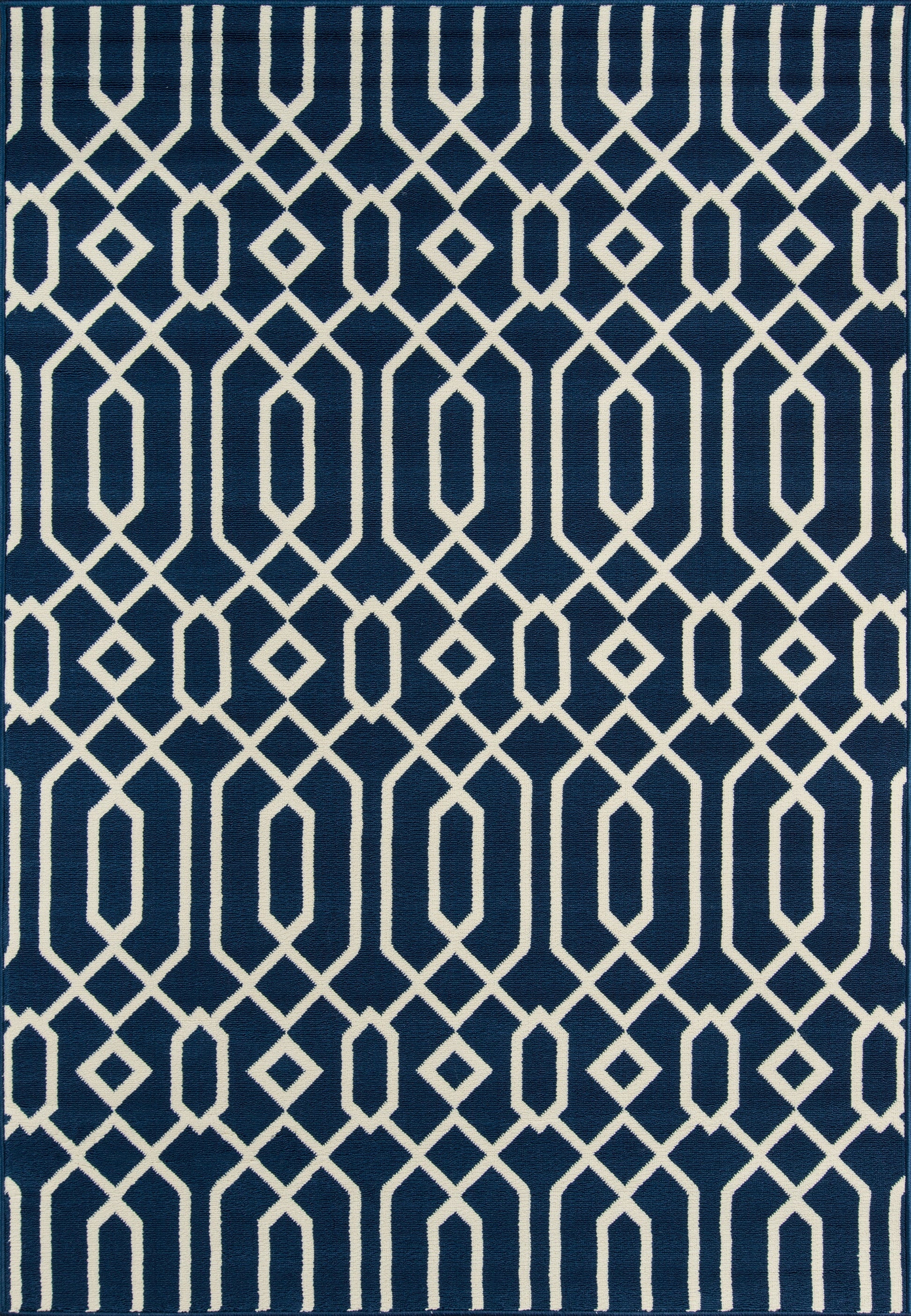 Navy blue area rug with white interlocking diamond lattice pattern, modern geometric style.