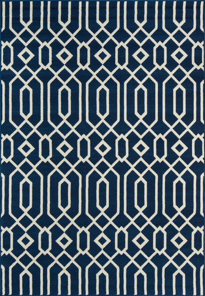 Navy blue area rug with white interlocking diamond lattice pattern, modern geometric style.