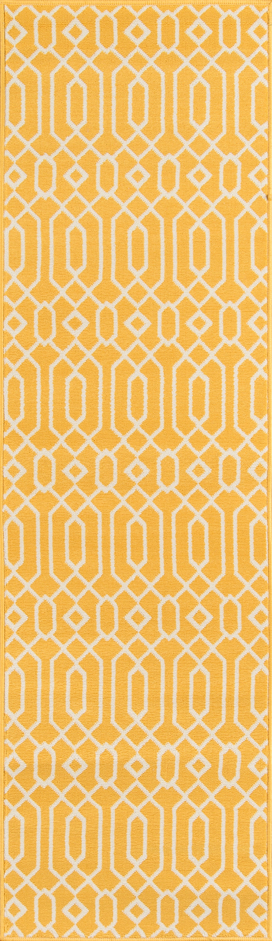 Yellow rug with a white geometric lattice pattern of interconnected diamonds and ovals.