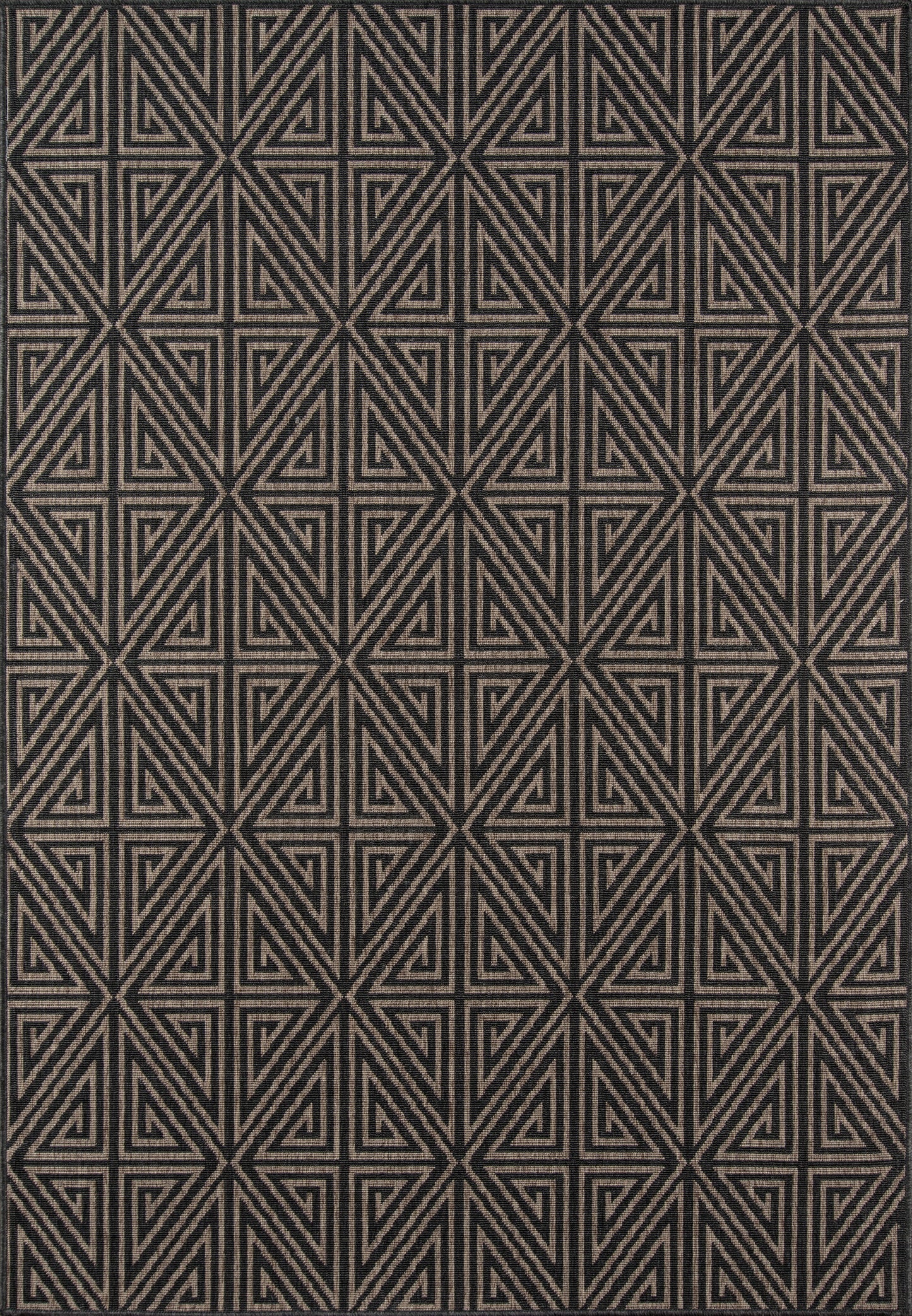 Textured charcoal rug with repeating beige geometric triangles in a bold maze-like pattern.