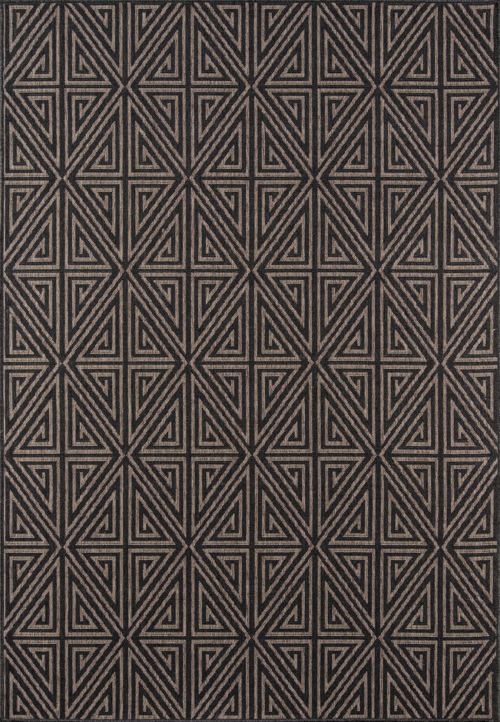 Textured charcoal rug with repeating beige geometric triangles in a bold maze-like pattern.